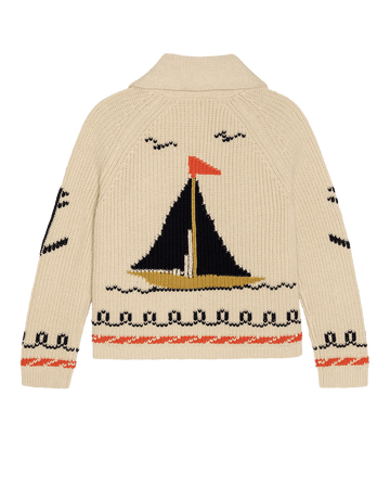 THE GREAT. SU26's The Sailboat Lodge Cardigan in cream features a large sailboat with birds and waves on the back, plus wave motifs on the sleeves and hem.