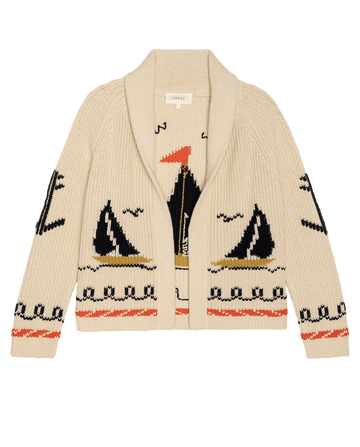 THE GREAT. SU26 The Sailboat Lodge Cardigan in cream features a shawl collar and a playful sailboat and seagull pattern in black, white, orange, and gold tones.