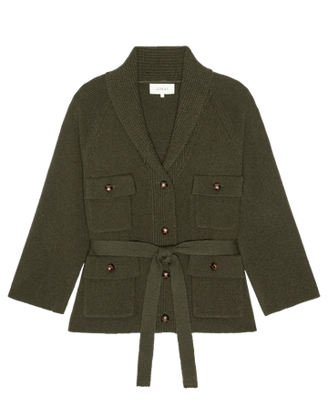 A rich army green "The Commander Riding Cardigan" by THE GREAT. F26 D1, featuring a shawl collar, button front, four flap pockets, and a matching tie belt, is laid flat on a white background.
