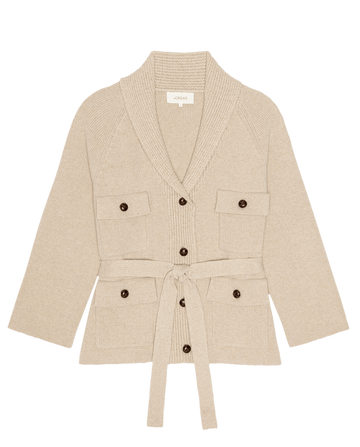 The Commander Riding Cardigan in Cream by THE GREAT. (F26 D1), featuring a shawl collar, front button closure, four patch pockets, and a matching tie belt, is laid flat on a white background.