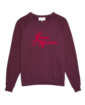 Mulled Wine "The College Sweatshirt" featuring "Feliz Navidad" in red text from THE GREAT. HOLIDAY 24 GRAPHICS, handcrafted in Los Angeles for a vintage-inspired charm.