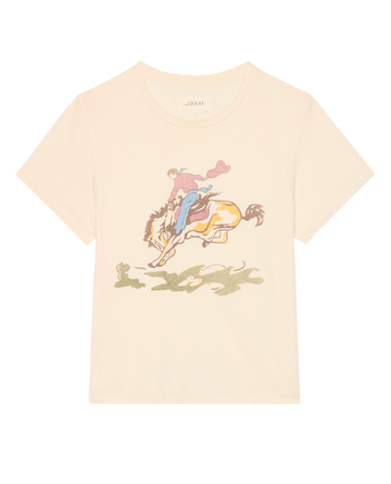 The Little Tee W/ Rider Graphic by THE GREAT. SP26 D1, in washed white, features a cowboy on horseback with a subtle shadowy ground below.