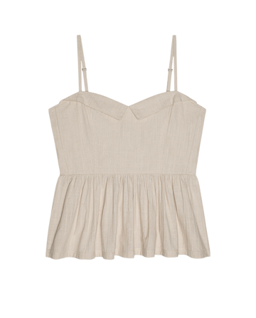 The Verse Top in Natural by THE GREAT. SU26 features a beige sleeveless design with thin adjustable straps, a subtle sweetheart neckline, and gathered waist detail, shown against a plain white background.