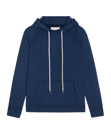 THE GREAT. H26 FLEECE BACK KNITS The Fleece Pullover Hoodie in True Navy, featuring a long-sleeved silhouette with a front kangaroo pocket and thick white drawstring cords.