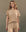 A person with long hair stands against a plain background, wearing The Boxy Crew by THE GREAT. SP25 D2, a khaki casual outfit adorned with delicate daisy embroidery.