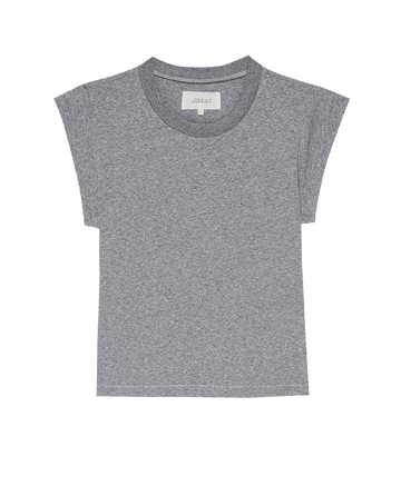 The Peak Shoulder Tee in Heather Grey by THE GREAT. FALL 22 KNITS features a crew neckline and a subtle pocket on the left chest, making it the perfect match for high-waisted denim.