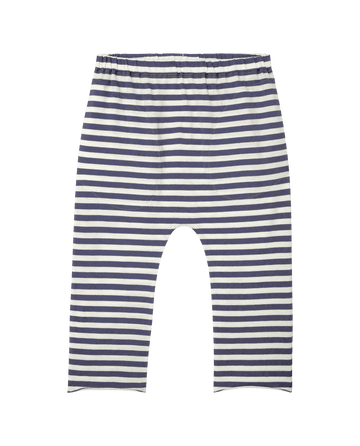 Striped navy and white pants with an elastic waistband are displayed on a plain backdrop, stylishly matched with The Little Jersey Crop in Vintage Blue Stripe by THE GREAT. SP25 POLO LOUNGE LITTLE for a chic, effortless look.