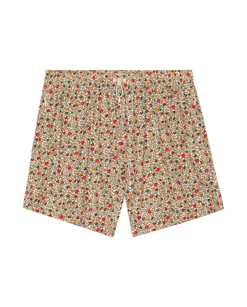 The Rover Short – Sprouting Floral by THE GREAT. SP26 TGO features a drawstring waist and floral print in red, yellow, and green on a light background. These casual men's shorts are displayed flat on a white surface.