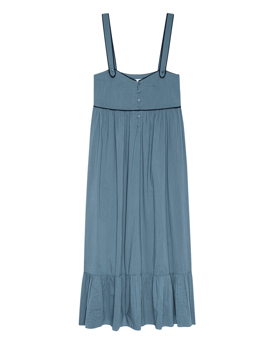 The Western Tank Night Dress - Blue Dusk by THE GREAT. SP25 SLEEP features wide shoulder straps, a buttoned bodice, gathered waist, and ruffled hem—ideal for chic Western-inspired nights.