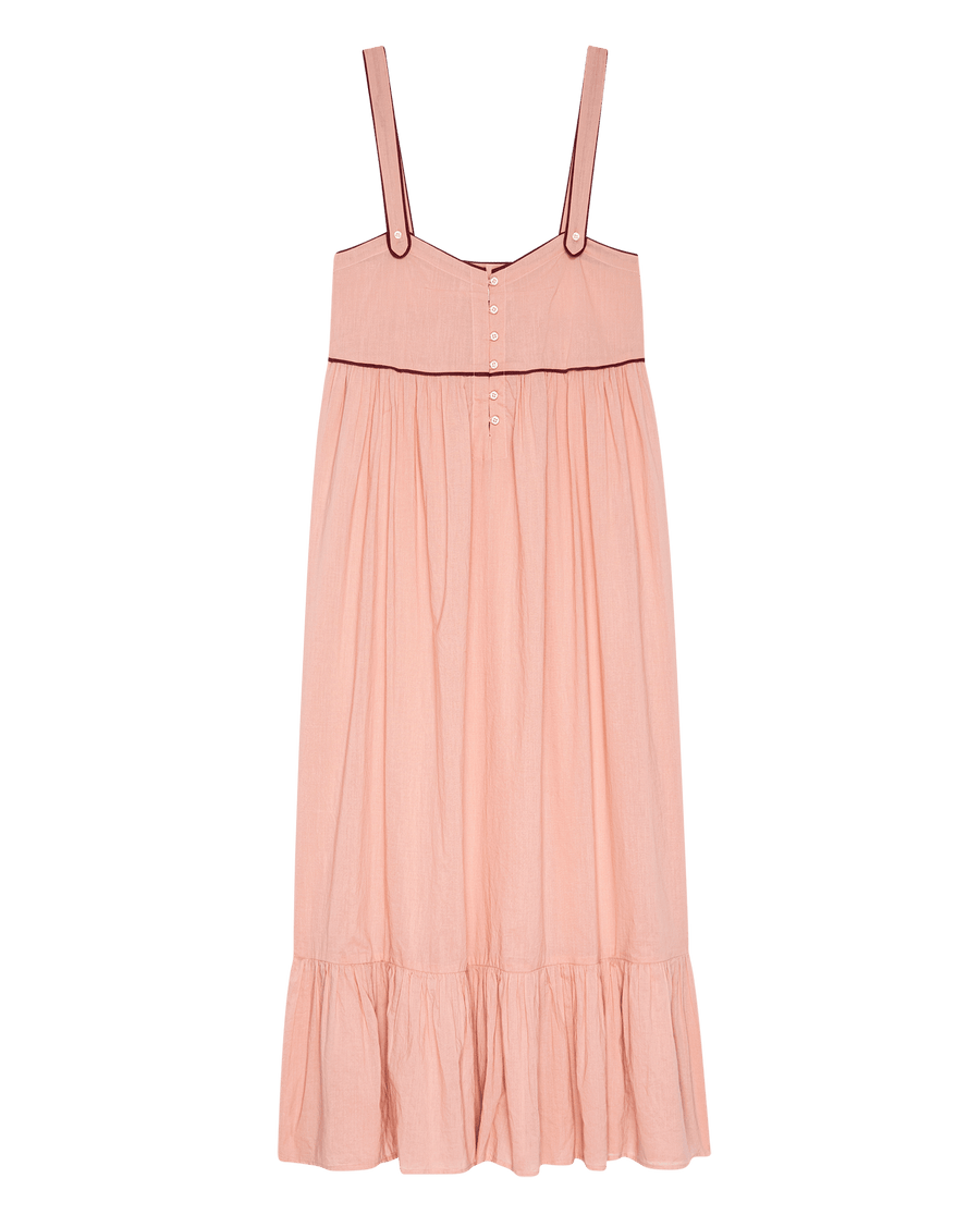 The Western Tank Night Dress—Rose Bloom by THE GREAT. SP25 SLEEP features spaghetti straps, button chest details, empire waist, and a ruffled hem—a stylish light pink night dress for your wardrobe.