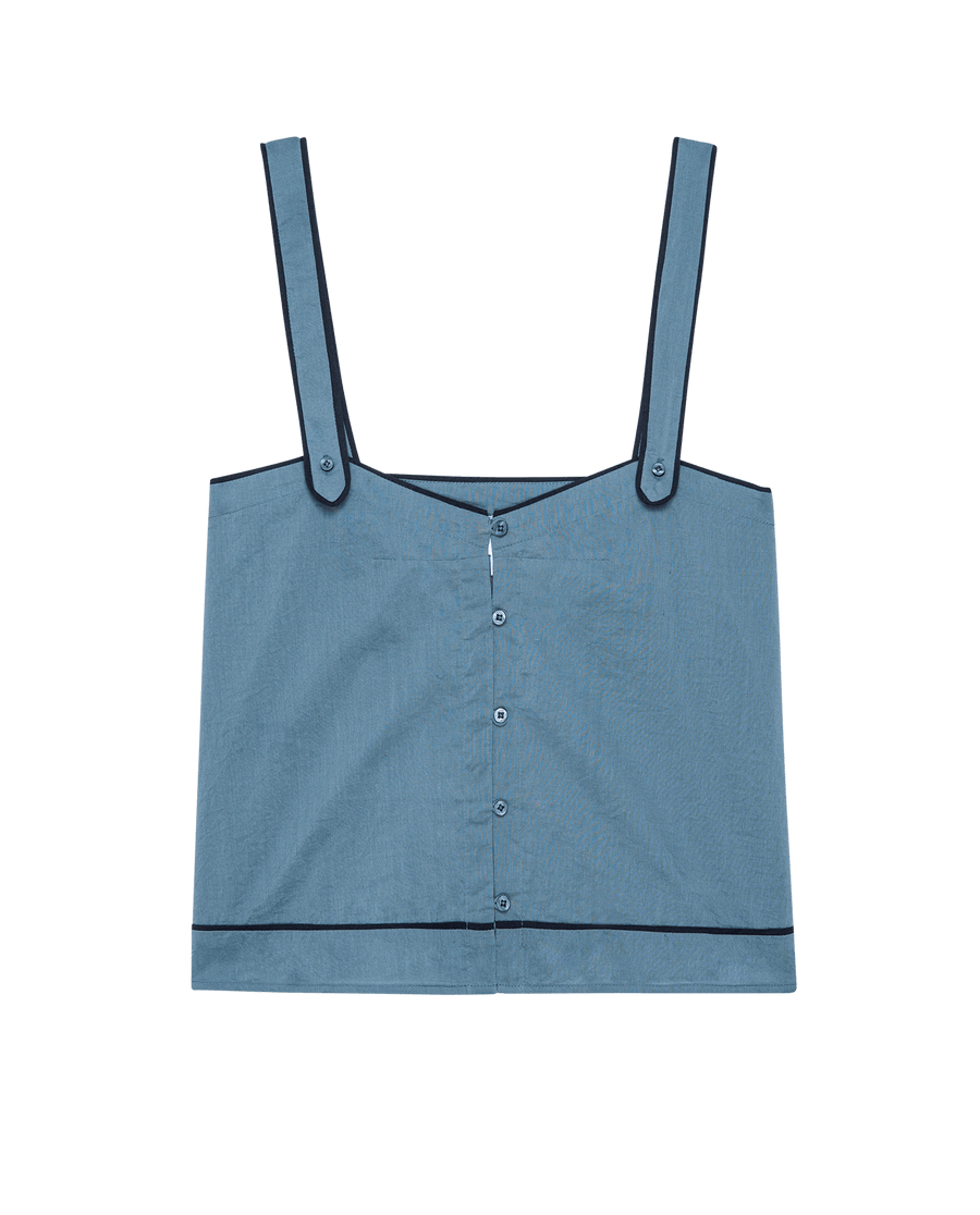 The Western Sleep Cami in Blue Dusk by THE GREAT. SP25 SLEEP features wide straps, a front button closure, and black trim—ideal for stylish sleepwear or lounging.