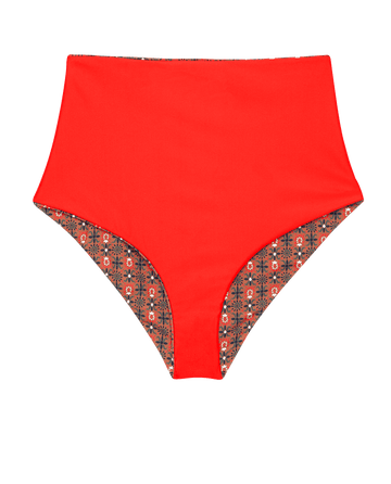 THE GREAT. SP25 SWIM The Reversible Mid Rise Brief features a rust tile print on one side and hot red on the other, offering versatile styling with its reversible design.
