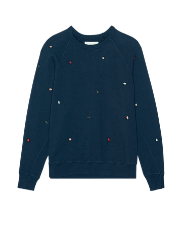 THE GREAT. PS26 College Sweatshirt W/ Tossed Floral Emb. in navy features small, multicolored embroidered flowers scattered across the front and sleeves for a vintage crewneck look.