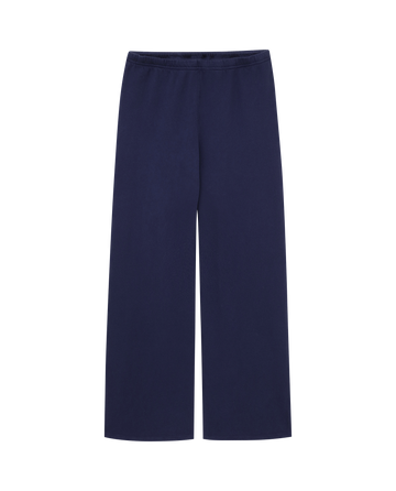 The Lap Sweatpant. Solid -- True Navy by THE GREAT. CORE KNITS: straight-leg, navy blue sweatpants with an elastic waistband, shown flat on a plain background.