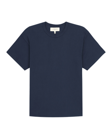 The Men's Boxy Crew in True Navy by THE GREAT. FALL 23 MEN is a wardrobe staple featuring a round neckline, crafted from 100% cotton, and showcased against a plain background.