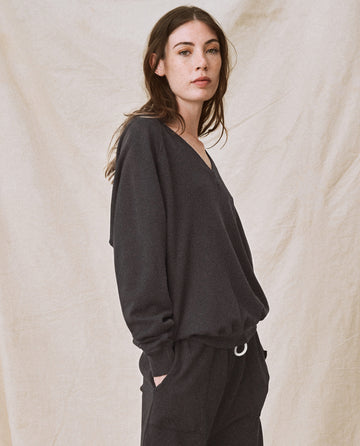 The V-Neck Sweatshirt. -- Washed Black SWEATSHIRTS THE GREAT. FALL21 KNITS