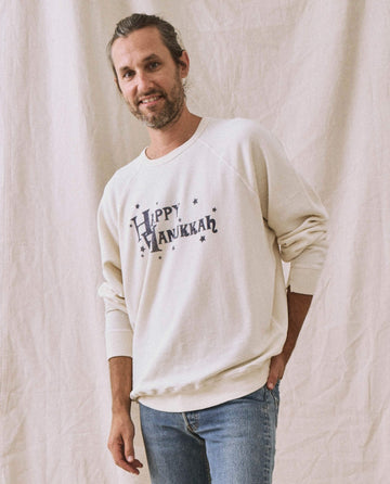 The Men's College Sweatshirt. -- Washed White with Hanukkah Graphic SWEATSHIRTS THE GREAT. HOLIDAY GRAPHICS MENS