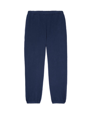 Image of The Men's Stadium Sweatpant in True Navy by THE GREAT. HOL 22 MEN, featuring an elastic waistband and cuffs, laid out flat on a white background.