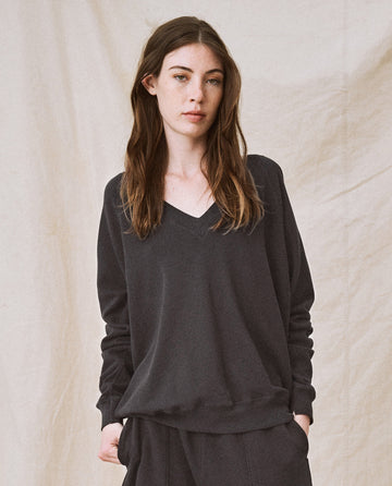 The V-Neck Sweatshirt. -- Washed Black SWEATSHIRTS THE GREAT. FALL21 KNITS