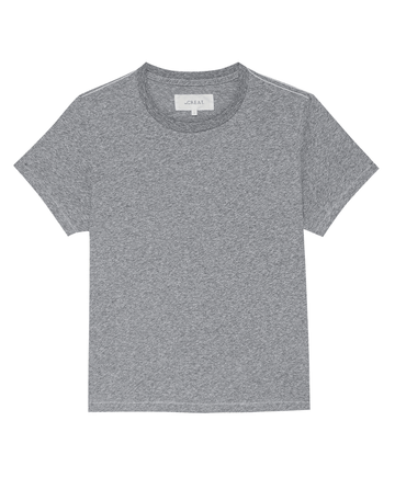 A classic heather grey short-sleeve t-shirt, The Little Tee. -- Heather Grey by THE GREAT. SP22 APRILCAP, is showcased against a white background. Perfect for a comfortable fit and ideal for layering, it exudes an effortlessly vintage vibe.