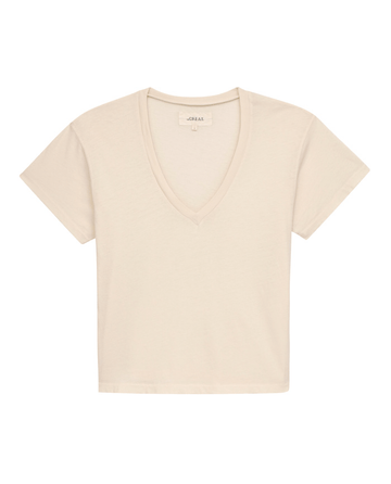 A boxy-fit, V-neck t-shirt in washed white on a white background, from THE GREAT. SP22 APRILCAP's The V-Neck Tee collection.