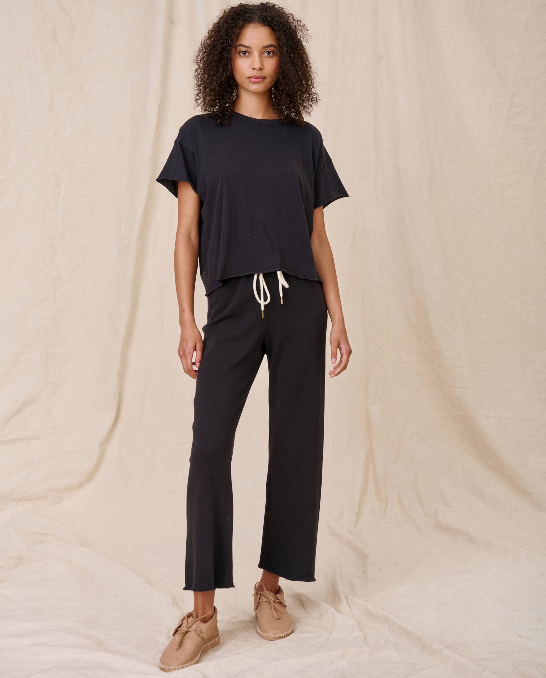 The Wide Leg Cropped Sweatpant. -- Almost Black SWEATPANTS THE GREAT. CORE KNITS